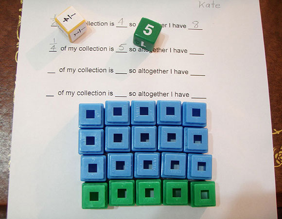 Two dice, one die displaying 1/4 and the other 5. One set of 5 cubes in one colour, three sets of 5 cubes in another colour to make a total of 20.